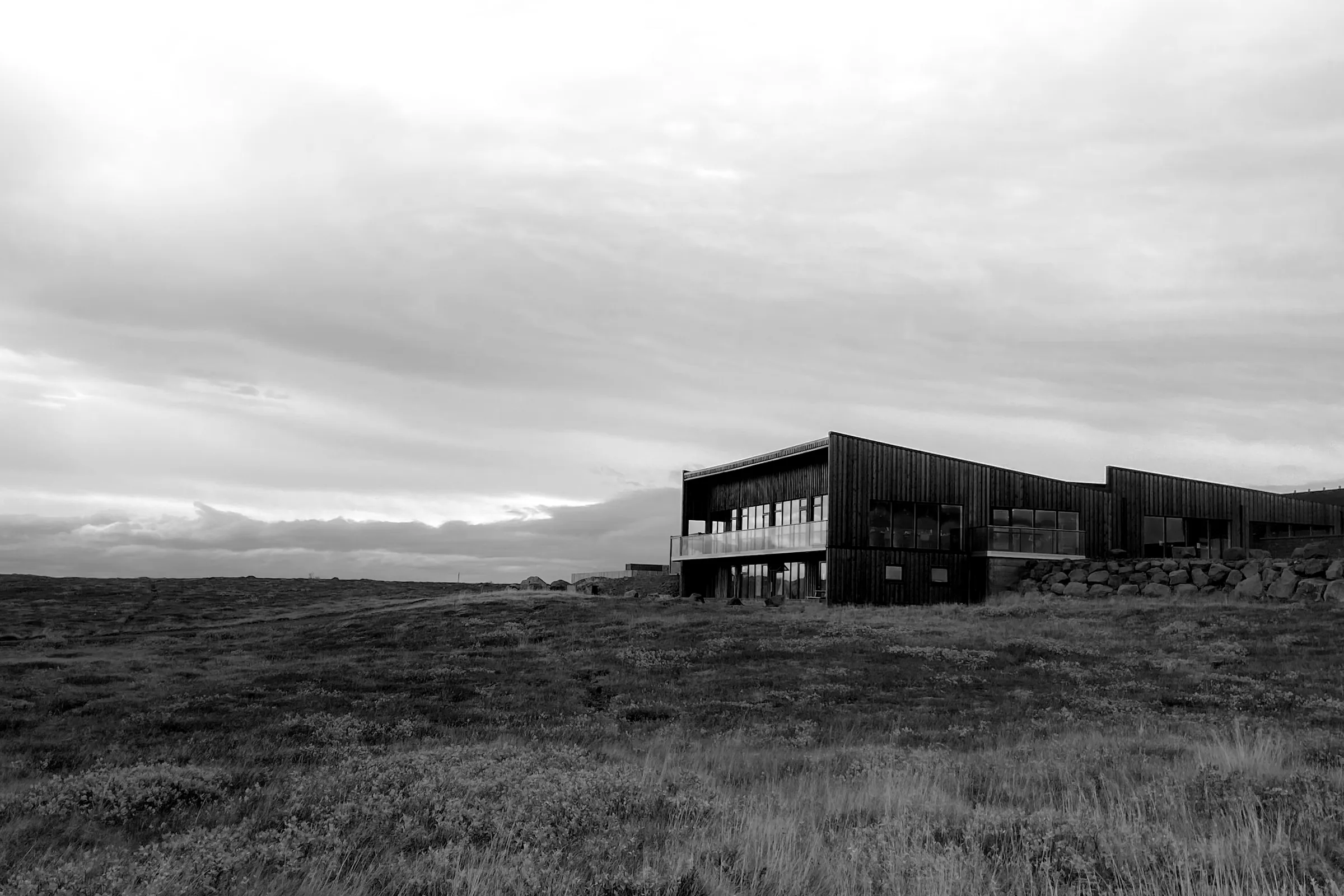Low black timber house on an Icelandic heath